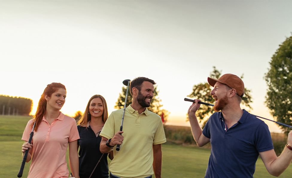 Friends smiling at a golf course